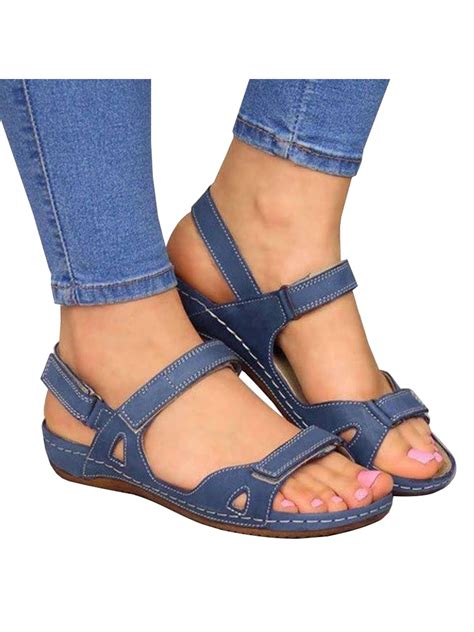 flat sandals with velcro straps.